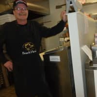 <p>Eric Screnock, owner of That Awesome Deli, at 22 Belltown Road stands in the area where he makes gluten-free and regular sandwiches. He prepares them in different parts of the kitchen to ensure there isn&#x27;t cross contamination.</p>