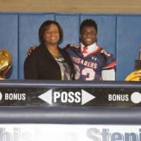<p>Malcolm Major of Archbishop Stepinac is joined by his mother as he signs to attend Assumption. Major lives in Yonkers.</p>