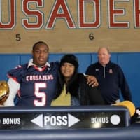 <p>Chris Jordan of Yonkers-, joined by his mother, will attend Fayetteville State University.</p>