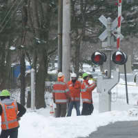 <p>Workers checked the signals at the intersection where the fatal crash took place.</p>