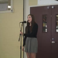 <p>Kelly Hooper performs a song at Briarcliff High School.</p>
