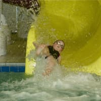 <p>A youngster makes a quick trip down a slide at the Splash Zone at Chelsea Piers Connecticut in Stamford. </p>