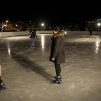 <p>A little one hits the ice under the stars on a recent cold evening in Stamford. </p>