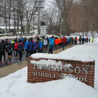 <p>Racers walk to the starting line at Tomlinson Middle School on Sunday, Feb. 8, for the Fairfield&#x27;s 20K Boston Buildup Race.</p>