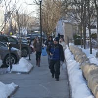 <p>Shoppers make their way along the sidewalks on a chilly day in Greenwich. </p>