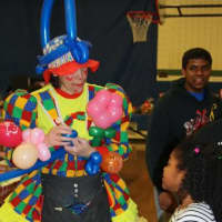 <p>Clowns made balloons for students.</p>