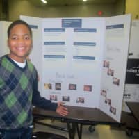 <p>A student presents his project on physical and chemical connection.</p>