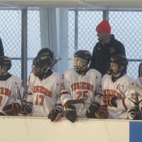 <p>White Plains bench watches the action.</p>