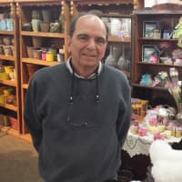 <p>Joseph Lodovico, owner of Harrison Flower Mart, keeps the price of a dozen roses at $65 this week.</p>