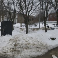 <p>Piles of snow fill the landscape at the Danbury Library. </p>