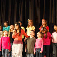 <p>Students from Anne Hutchinson School and Greenvale School were joined by Broadway performer Olivia Oguma in song. </p>