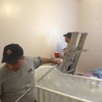 <p>Brother knights repaint the Malta House, a facility offering services to unwed mothers. </p>