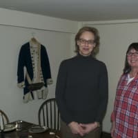<p>Hildi Grob, left, the executive director of Keeler Tavern Museum, and Erika Askin, Collections Curator, stand in the Assembly Room.</p>