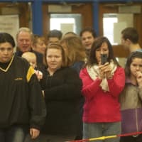<p>Observers enjoy the mat action at Westlake HS.</p>
