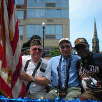 <p>The USA Flag with Veterans Float, L-R: Marvin Schwartz (WWII), Alan Ascher (Korea), James Tuzzy, IV (Vietnam).</p>