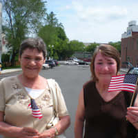 <p>Josephine Larcey and Betty Falla of New Rochelle showed their patriotism, waving miniature flags.</p>