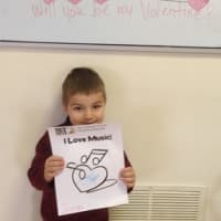 <p>A preschool music student shares his coloring project and song that his class composed with magnetic hearts from the Li&#x27;l Peeps Creative Music Program.</p>