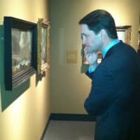 <p>U.S. Rep. Jim Himes, D-Conn., a Cos Cob resident, looks at some of the art on display at the Bruce Museum on Wednesday.</p>