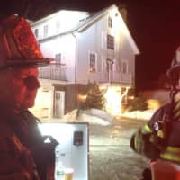 <p>Assistant Fire Chief George Gomola and Lt, Dennis Eannotti at the 33 Chester Place fire. </p>