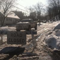 <p>A portion of Adelphia Avenue in Harrison, N.Y., is closed to traffic where a recently retired White Plains police officer is alleged to have shot to death his two teenaged daughters and then killed himself Saturday.</p>