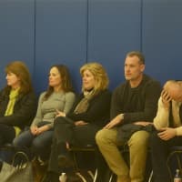 <p>Parents watch from the sidelines.</p>