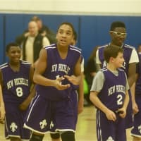 <p>New Rochelle players walk off happy after Dylan Farley (12) hit the game-winning shot.</p>