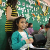 <p>A student waits her turn to participate in the spelling bee.</p>