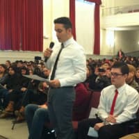 <p>Joseph Vukel, president of the Steps to American Greatness club at Stamford High, prepares to ask a question of Gov. Dannel P. Malloy at a student assembly at the school.
</p>