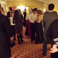 <p>Guests mingle at the party Sunday at The Avon in Stamford.</p>