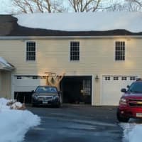 <p>The homeowner hit her garage with her car in to the 4 p.m. accident. </p>