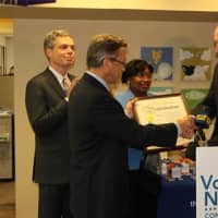 <p>Mark Rollins, Volunteer New York! board chair, receives a proclamation from Deputy County Executive Kevin Plunkett, while White Plains Mayor Tom Roach and state Sen. Andrea Stewart-Cousins look on. </p>