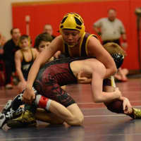 <p>Koy Price of the Norwalk Mad Bulls controls his opponent en route to his fourth straight regional wrestling championship.</p>