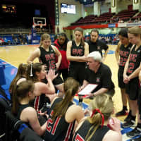 <p>The Garnets talk strategy during timeout.</p>