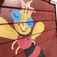 <p>The red bee on the side of the Weston home where Carla Marina Marchese works.</p>