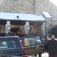 <p>More than 100 police and firefighters lined up as Bishop Gerald Walsh led a procession out of Friday&#x27;s funeral mass.</p>
