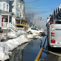 <p>Hanover Street is flooded and filled with fire equipment. </p>