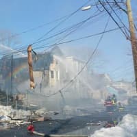 <p>Two houses are destroyed and a third is heavily damaged from the huge fire. </p>