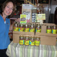 <p>Barb Kobren stands next to a display at Murray&#x27;s Cheese Shop. </p>