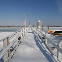 <p>A snow-covered dock has not seen a visitor in a while. </p>