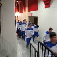 <p>The Haldane boys varsity team warmed up in the hallways of the Westchester County Center.</p>