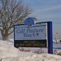 <p>Calf Pasture Beach is closed for winter, although a few die-hard fans still head out for walks. </p>