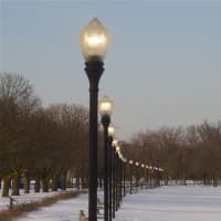 <p>Lights come on adding to the beauty of the snow-covered beach</p>