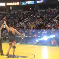 <p>Youssif Hemida, state wrestling champion, after winning it all in Albany on Saturday.</p>