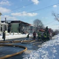 <p>Firefighters continue to fight hot spots in the building. </p>