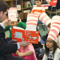 <p>New Rochelle Superintendent of Schools Brian Osborne reads &quot;Green Eggs and Ham&quot; to an attentive Trinity Elementary School class. </p>