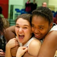<p>Ossining teammates celebrate after beating Lourdes.</p>