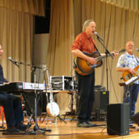 <p>Folk musician Tom Chapin, center, performed with his bandmates at Todd Elementary School in Briarcliff Manor.</p>
