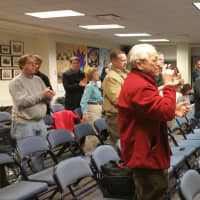 <p>Chris Tymniak&#x27;s speech is met with a standing ovation by more than 40 RTC members on March 2.</p>