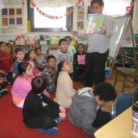 <p>Ellen Telep reads to her third-grade students during World Read Aloud Day at Edison elementary School.</p>
