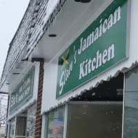 <p>Light snow falls Thursday at Stan&#x27;s Jamaican Kitchen in Fairfield. </p>